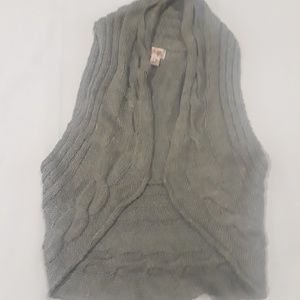 Gray sweater vest and pair of leg warmers